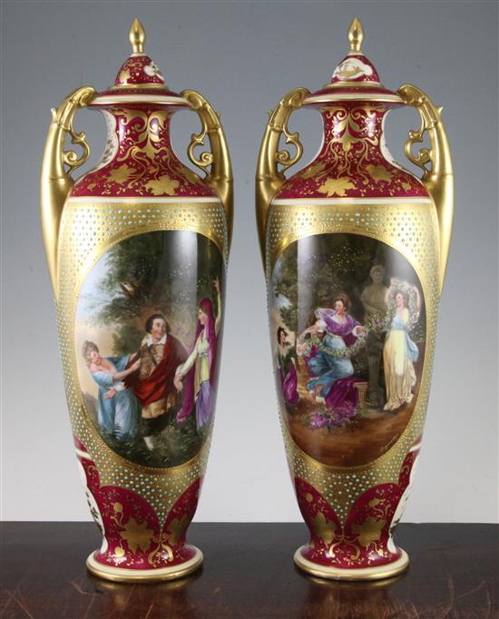 A pair of Vienna style porcelain twin handled vases and covers, c.1880-1900, 41.5cm, damages to cove